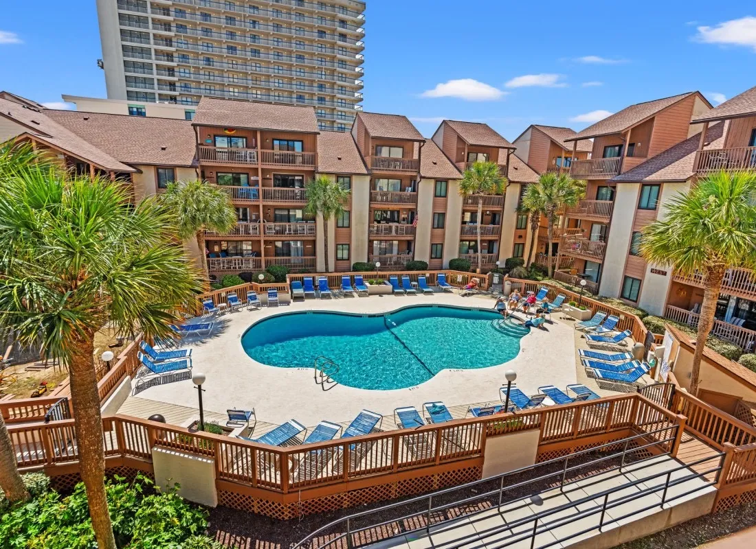 Condominium buildings and balconies at Anchorage, viewed from above the pool courtyard