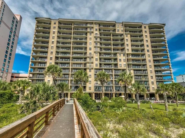 Oceanfront condominium tower and boardwalk at the Southwind property